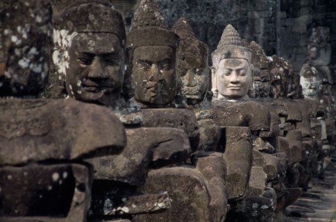 CAMBODIA, Siem Reap, Angkor Thom, South Gate causeway lined with statues of various gods the paler