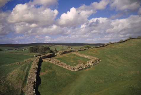 ENGLAND, Northumberland, Hadrians Wall, Cawfields Milecastle along section of ruined wall over Whin