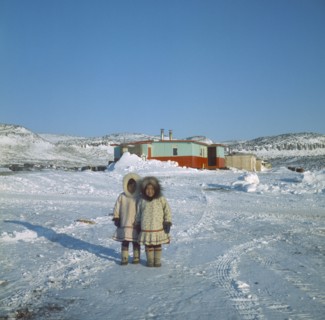 CANADA, Nunavut, Baffin Island, Young Innuit girls outside settlement.
