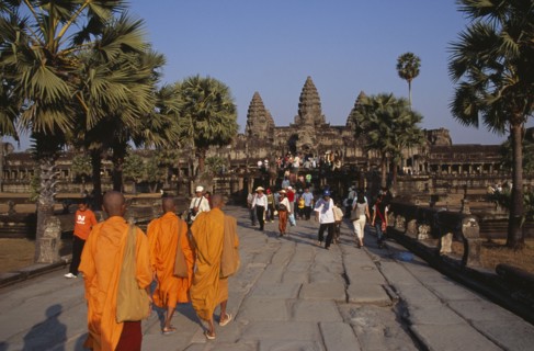 CAMBODIA, Siem Reap Province, Angkor Wat, Buddhist monks and tourists during Chinese New Year on