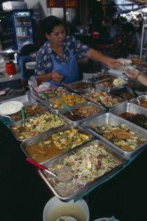 THAILAND, South, Bangkok, Woman selling cooked meals in an alley beside Patpong 1