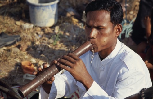 CAMBODIA, Siem Reap, Angkor Wat, Traditional Khmer flautist accompanying shaman ceremony