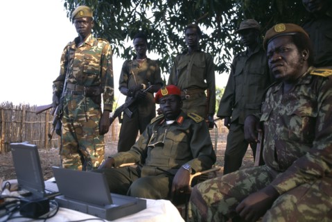 SUDAN, Marida, Commander Geia of the SPLA army sat down surrounded by soldiers with a lap top