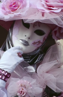 ITALY, Veneto, Venice, Venice Carnevale. Close up portrait of a female figure dressed in a white