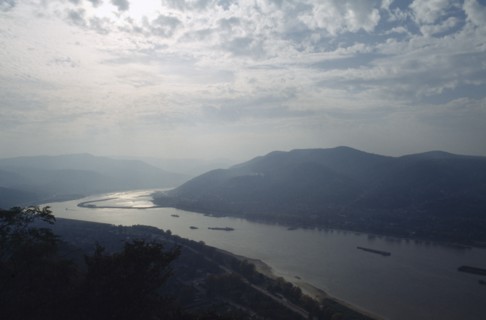 HUNGARY, River Danube, Bend in river and surrounding landscape in low light.