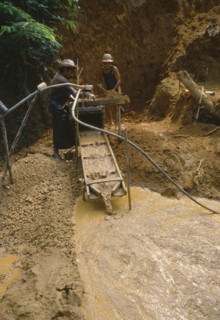 BRAZIL, Serra Pelada, Gold miners panning for gold.