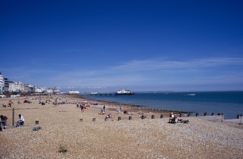 20059183 ENGLAND East Sussex Eastbourne View across shingle beach towards the pier in the far distance.