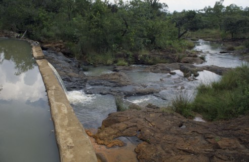 KENYA, Kipsaraman, Dam built by local woman Pauline Rerimoi.  Previously she had had to carry a