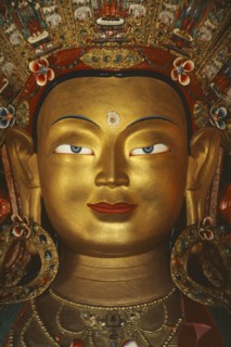 INDIA, Ladakh, General, Golden face of Buddha.  Tibetan Buddhism is practised in this area of