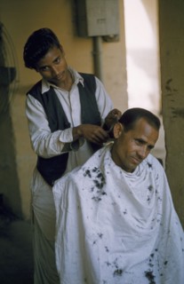INDIA, Personal Grooming, Young barber and customer.