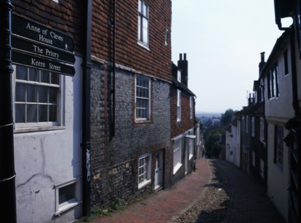 20059219 ENGLAND East Sussex Lewes View down cobbled old street with cottage housing and a street sign showing directions towards the Ann of Cleves House and The Priory.