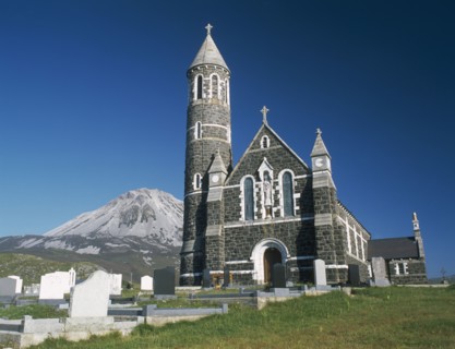 IRELAND, County Donegal, Dunlewy Village, Roman Catholic church and graveyard with Errigal peak of