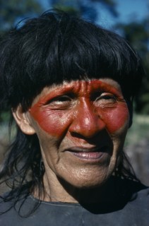 ECUADOR, Amazon, People, Portrait of Auca Indian with red face paint from achole plant.