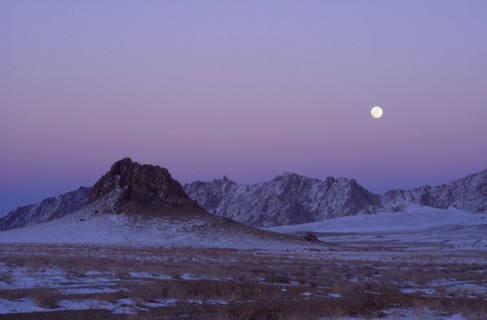MONGOLIA, "				", Hovd Province, Mountains lightly covered in snow at sunset with pink sky. Rtnd 2