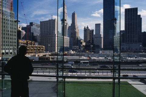 USA, New York, Manhattan, People looking over Ground Zero during reconstruction of the World Trade