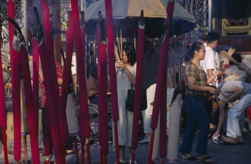 MALAYSIA, Penang, Georgetown, Kuan Yin Teng or Temple of Mercy with people carrying jos sticks and