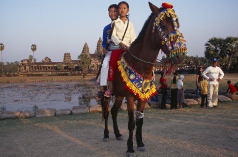 CAMBODIA, Siem Reap Province, Angkor Wat, Cambodian children visiting Angkor during the Chinese New