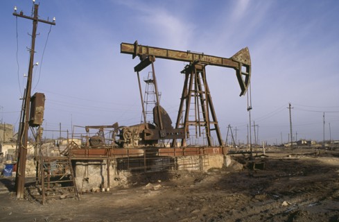 AZERBAIJAN, Baku, Nodding Donkey oil derrick on industrial site near Baku.