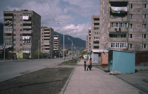 ARMENIA, Vanadzor, Children on street beside residential flats.