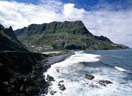 SPAIN, Canary Islands, La Gomera, Hermigua.  Coastal landscape with narrow beach of black volcanic