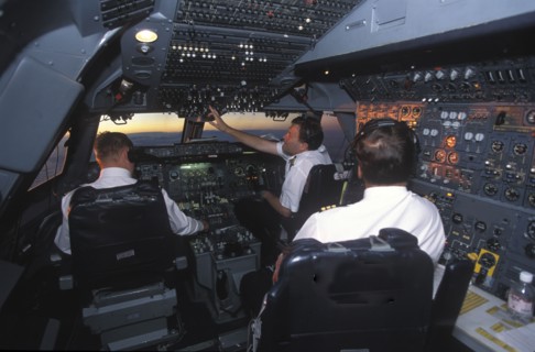 SOUTH AFRICA, Central, South African Airways Boeing 747 300 cockpit with pilot and crew at daybreak