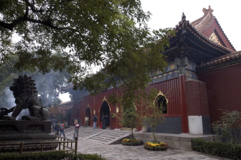 CHINA, Beijing, Lama Temple. People looking around the buildings of the Temple complex with stone