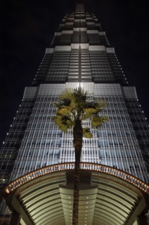 CHINA, Shanghai, Angled view looking up at the Hyatt Hotel skyscraper illuminated at dusk with