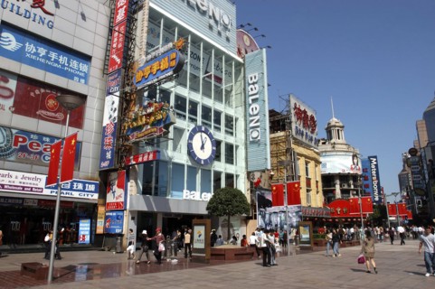 CHINA, Shanghai, Nanjing Road walking street. Commercial shopping street with building facades