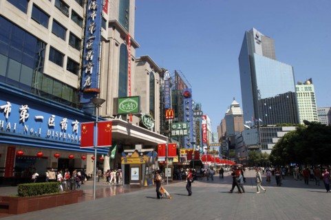 CHINA, Shanghai, Nanjing Road walking street. Commercial shopping street with building facades