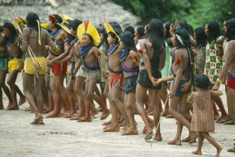 BRAZIL, Amazonas, People, Group of Xikrin Indians wearing feather head dresses and bead jewellery