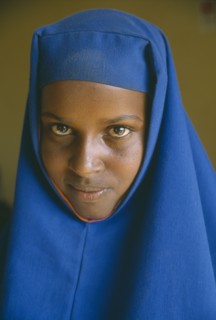 ETHIOPIA, Jijiga, Portrait of Somali girl in blue head dress.  The Somali are one of the key ethnic