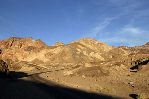 USA, California, Death Valley, View over layered sculpted rock hills in the golden afternoon sun