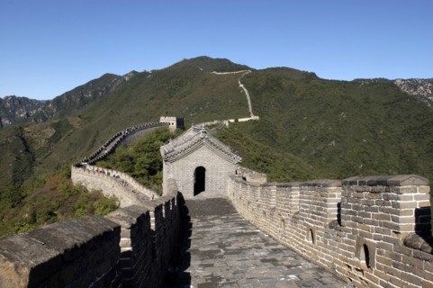 CHINA, Great Wall, View along a section of the wall which runs through the green hilly landscape