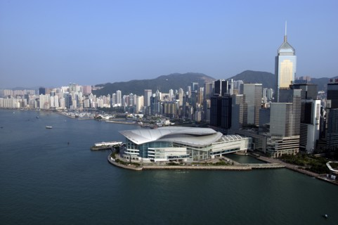 HONG KONG, Kowloon, Aerial view over the New Convention Centre on the waterfront and cityscape