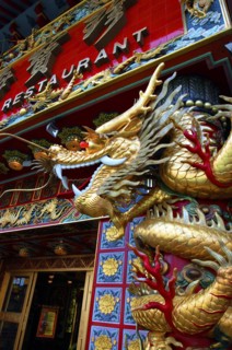 HONG KONG, General, Elaborately decorated Restaurant exterior with golden dragon sculpture