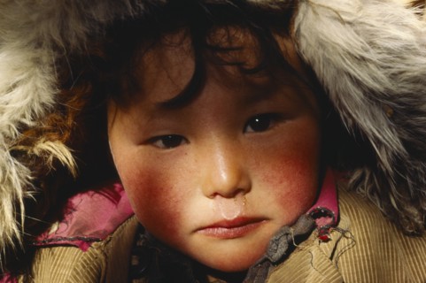 CHINA, Xinjiang, Altai, Portrait of Kazakh child.