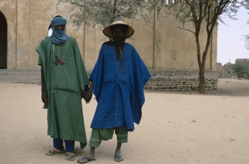 MALI, People, Two Touareg men in traditional dress holding hands.