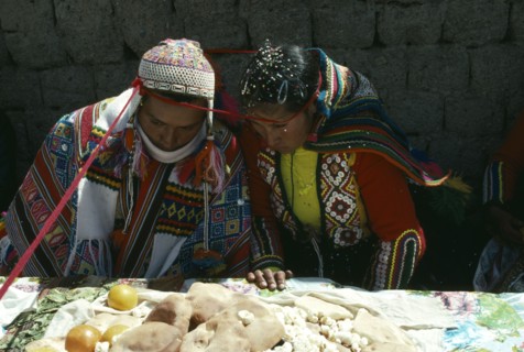 PERU, Cordillera Vilcanota, Bride and groom during their wedding ceremony with length of red
