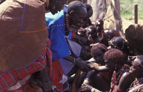 KENYA, Kajiado, Maasai Moran have the fat from a sacrificial cow daubed on them as well as taking a