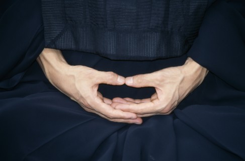 JAPAN, Zen, Cropped view of monk in Zen Buddhist monastery showing hands in Mudra the position of