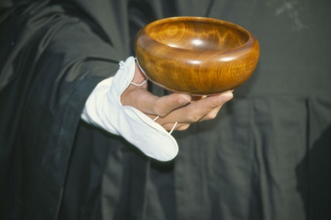 JAPAN, Obama, Cropped view of Zen Buddhist monk holding bowl for collection of alms.