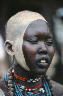 SUDAN, Body Decoration, Portrait of young Dinka woman with facial decoration of ash paint and
