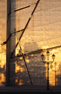 GERMANY, Berlin, Detail of the Judisches Museum metalic exterior reflecting the orange light of the