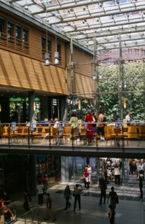 GERMANY, Berlin, Potsdamer Platz. Cafe on mezzanine floor in Daimler City with shoppers below