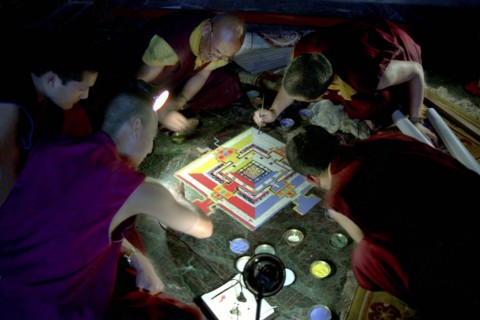 INDIA, Sikkim, Rumtek Gompa, Several monks painting decorative patterns for the Pujar ceremony  and