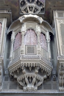 INDIA, Rajasthan, Jaisalmer, Detail of elaborate hand carved window frame of the Patwon Ki Haveli