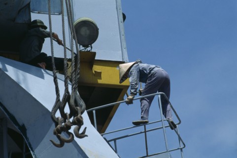 VIETNAM, North, Haiphong, Maintenance worker at Doan Xa container terminal.