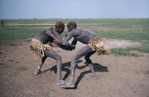 SUDAN, Tribal People, Dinka tribesmen wrestling.