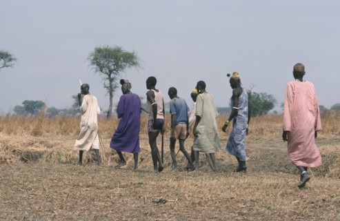 SUDAN, Wedding, Dinka bridegroom in purple with members of his clan who will negotiate a bride