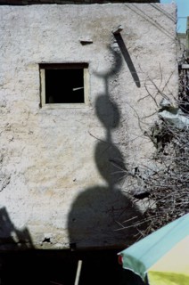 CHINA, Xinjiang, Kashgar, Shadow cast on a building wall of an Islamic crescent moon symbol usually